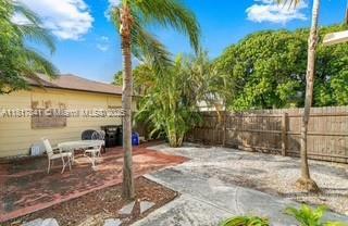 1416 N 2nd Ave N, Lake Worth, FL 33460 - fenced backyard with a patio