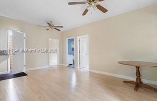 1416 N 2nd Ave N, Lake Worth, FL 33460 - unfurnished room featuring baseboards, ceiling fan, and wood finished floors