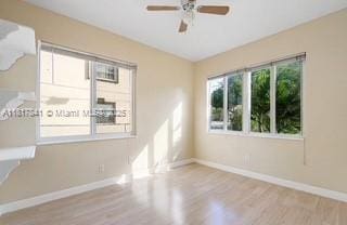 1416 N 2nd Ave N, Lake Worth, FL 33460 - unfurnished room featuring wood finished floors, baseboards, and ceiling fan