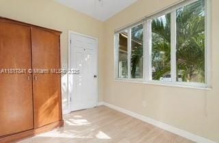 1416 N 2nd Ave N, Lake Worth, FL 33460 - entryway featuring baseboards and wood finished floors