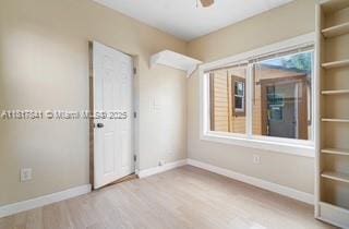 1416 N 2nd Ave N, Lake Worth, FL 33460 - unfurnished room with baseboards and wood finished floors