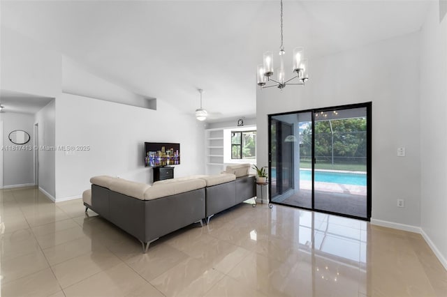 16040 SW 287th St, Homestead, FL 33033 - living area with baseboards, a chandelier, vaulted ceiling, light tile patterned flooring, and ceiling fan