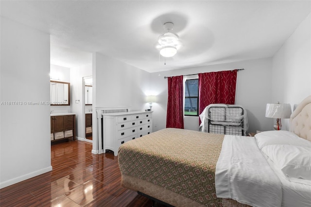 16040 SW 287th St, Homestead, FL 33033 - bedroom with dark wood-style flooring, baseboards, and connected bathroom