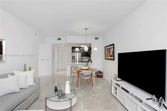 10 Aragon Ave Unit 919, Coral Gables, FL 33134 - living area featuring light marble finish flooring