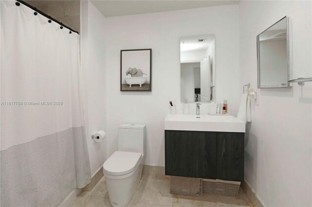 10 Aragon Ave Unit 919, Coral Gables, FL 33134 - bathroom featuring vanity, toilet, a shower with shower curtain, and baseboards