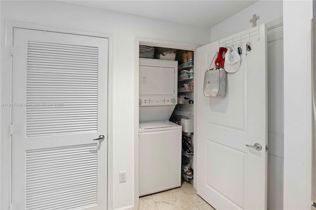 10 Aragon Ave Unit 919, Coral Gables, FL 33134 - laundry room featuring stacked washing machine and dryer and light marble finish flooring