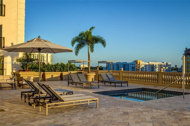 10 Aragon Ave Unit 919, Coral Gables, FL 33134 - view of pool featuring a patio area, a community hot tub, and a city view