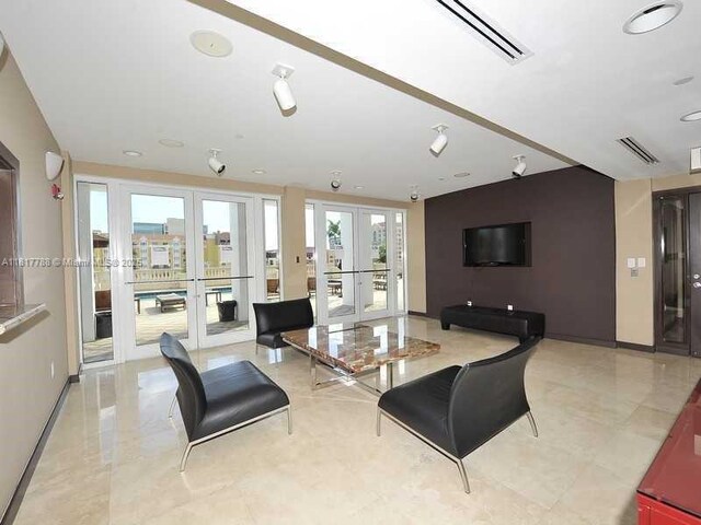 10 Aragon Ave Unit 919, Coral Gables, FL 33134 - living area featuring french doors and baseboards