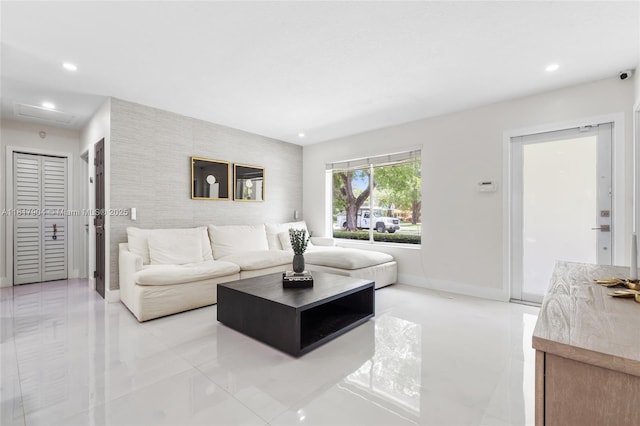 6301 Lake Geneva Rd, Miami Lakes, FL 33014 - living room with recessed lighting, an accent wall, attic access, baseboards, and light tile patterned floors