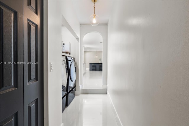 6301 Lake Geneva Rd, Miami Lakes, FL 33014 - hall featuring arched walkways and washer / clothes dryer