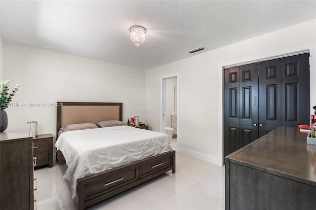 6301 Lake Geneva Rd, Miami Lakes, FL 33014 - bedroom featuring a closet, a textured ceiling, and ensuite bath