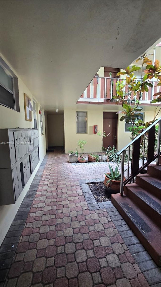 13655 NE 10th Ave Unit 108, North Miami, FL 33161 - view of patio featuring mail area and stairs