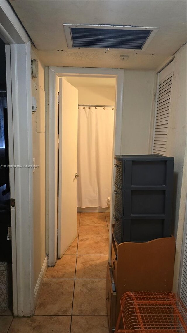 13655 NE 10th Ave Unit 108, North Miami, FL 33161 - hall with light tile patterned floors