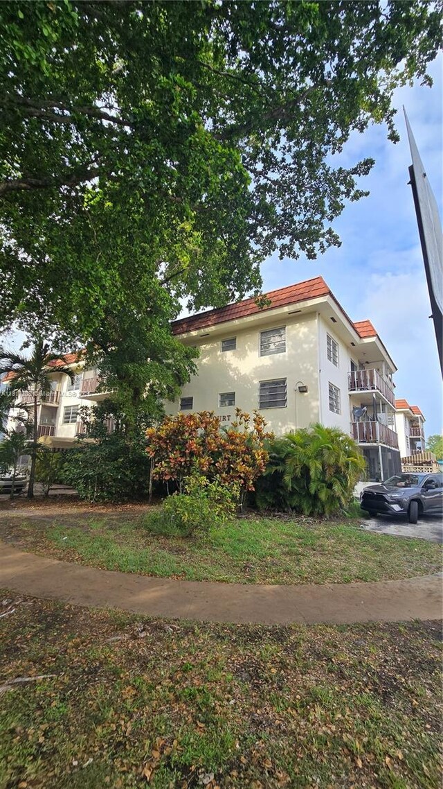 13655 NE 10th Ave Unit 108, North Miami, FL 33161 - view of home's exterior with stucco siding