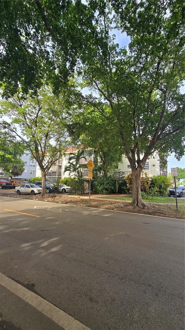 13655 NE 10th Ave Unit 108, North Miami, FL 33161 - obstructed view of property featuring uncovered parking