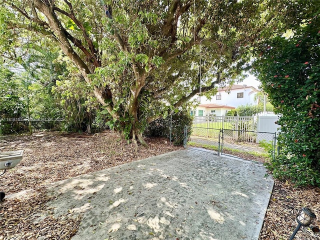 230 NE 2nd Pl, Dania Beach, FL 33004 - view of yard featuring a gate and a patio