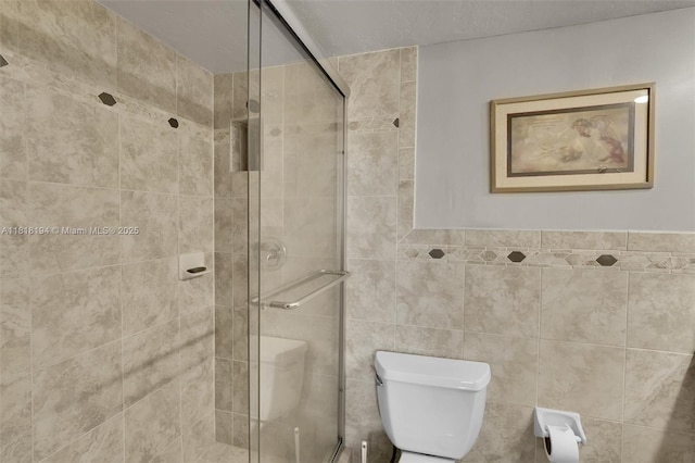 424 SE 10th St Unit 402, Dania Beach, FL 33004 - bathroom featuring toilet, a shower stall, and tile walls