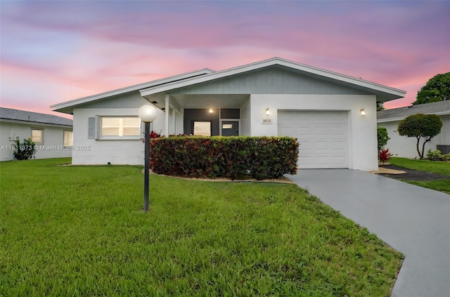 3810 Rowena Cir, West Palm Beach, FL 33417 - ranch-style home featuring a yard, concrete driveway, and an attached garage