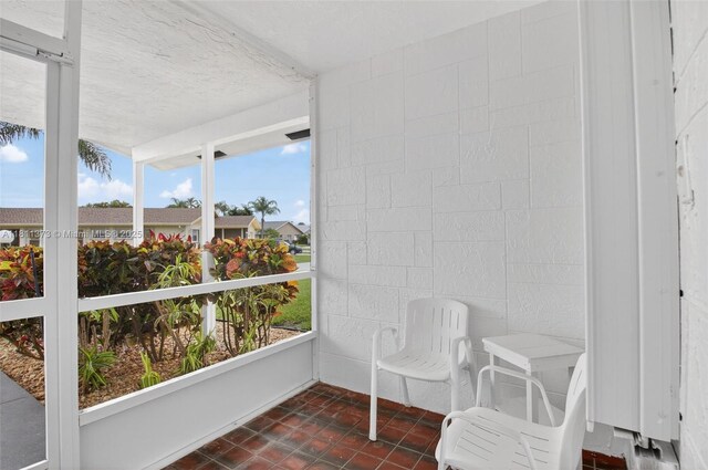 3810 Rowena Cir, West Palm Beach, FL 33417 - sunroom featuring plenty of natural light and a textured ceiling
