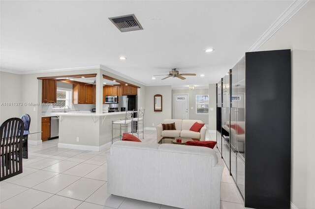 3810 Rowena Cir, West Palm Beach, FL 33417 - living area featuring crown molding, ceiling fan, recessed lighting, light tile patterned flooring, and baseboards