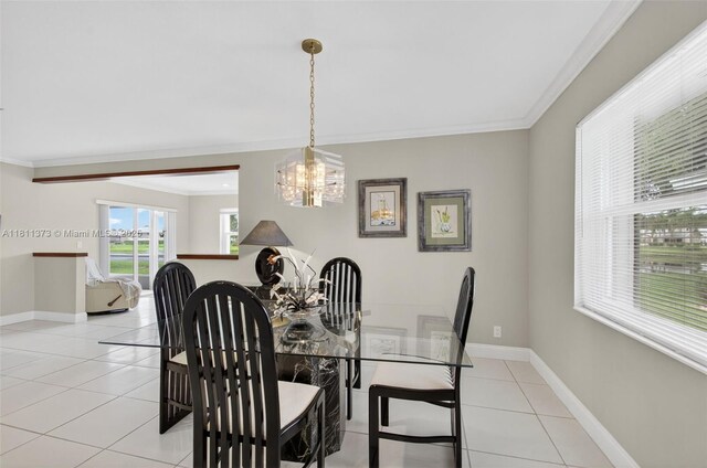 3810 Rowena Cir, West Palm Beach, FL 33417 - dining room featuring ornamental molding, a chandelier, light tile patterned flooring, and baseboards