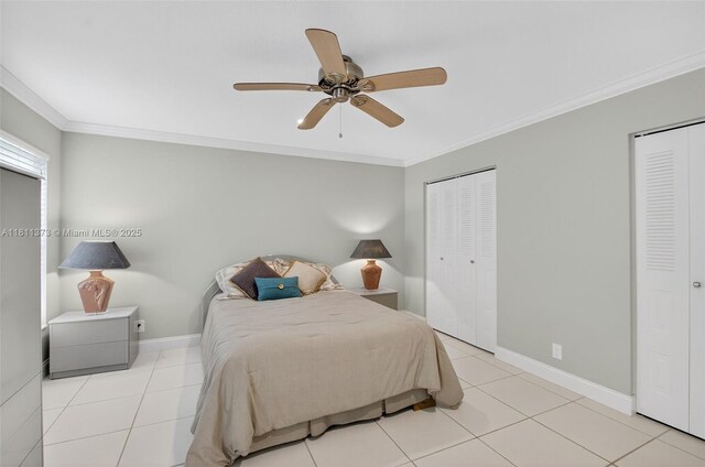 3810 Rowena Cir, West Palm Beach, FL 33417 - bedroom featuring multiple closets, ornamental molding, baseboards, ceiling fan, and tile patterned floors