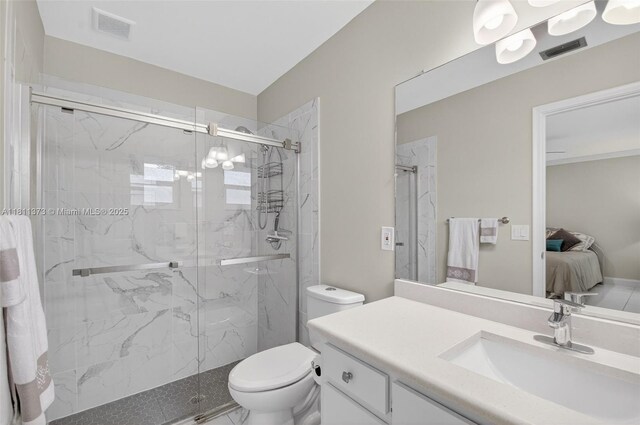 3810 Rowena Cir, West Palm Beach, FL 33417 - ensuite bathroom with a marble finish shower, toilet, and vanity