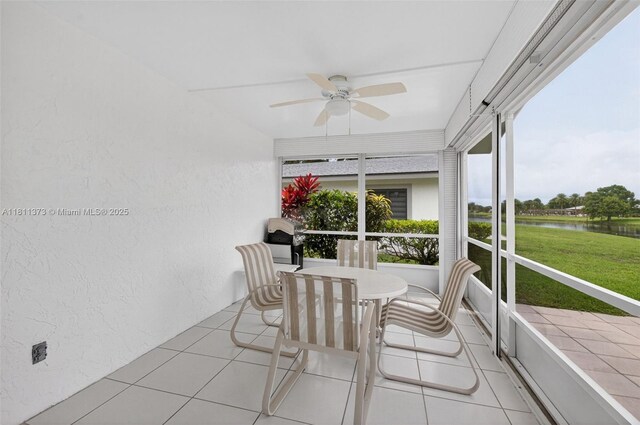 3810 Rowena Cir, West Palm Beach, FL 33417 - sunroom / solarium featuring ceiling fan, a water view, and outdoor dining area