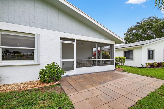 3810 Rowena Cir, West Palm Beach, FL 33417 - view of patio featuring a sunroom