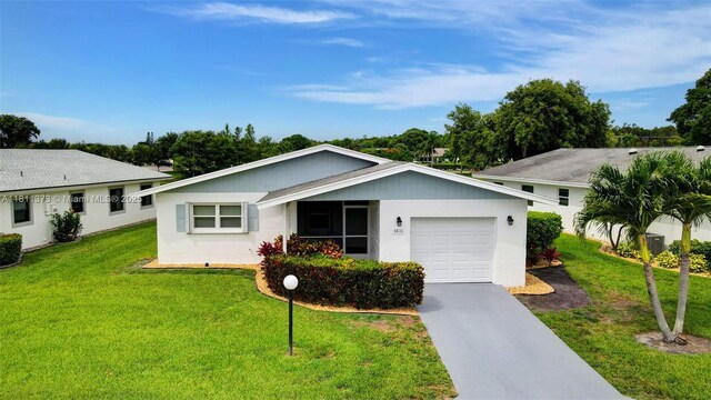 3810 Rowena Cir, West Palm Beach, FL 33417 - single story home with a garage, a front lawn, and concrete driveway