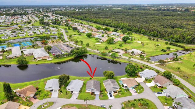 3810 Rowena Cir, West Palm Beach, FL 33417 - aerial view of property and surrounding area with a nearby body of water, nearby suburban area, a heavily wooded area, and a golf club