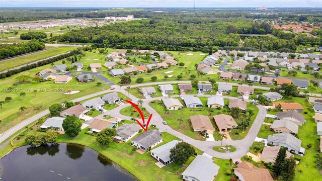 3810 Rowena Cir, West Palm Beach, FL 33417 - aerial overview of property's location featuring nearby suburban area, a large body of water, and a local golf course