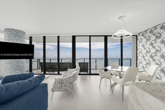 3131 NE 7th Ave Unit 3306, Miami, FL 33137 - dining space with a wall of windows, wallpapered walls, healthy amount of natural light, tile patterned flooring, and a water view