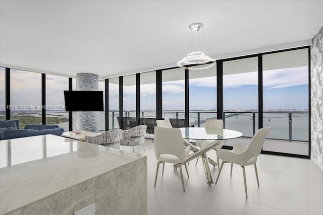 3131 NE 7th Ave Unit 3306, Miami, FL 33137 - dining area with a wall of windows and light tile patterned flooring