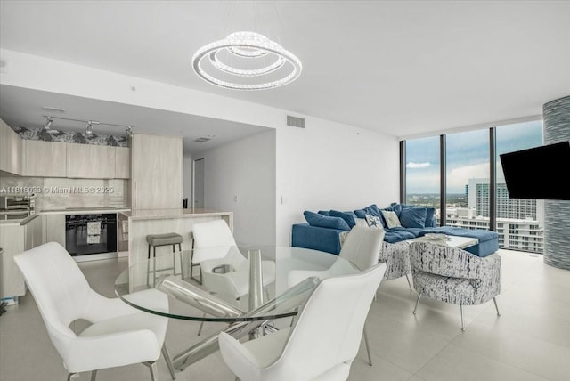 3131 NE 7th Ave Unit 3306, Miami, FL 33137 - dining area with floor to ceiling windows and a chandelier