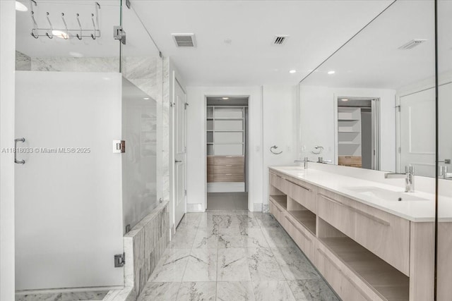 3131 NE 7th Ave Unit 3306, Miami, FL 33137 - full bathroom featuring a stall shower, marble finish floors, double vanity, a walk in closet, and recessed lighting