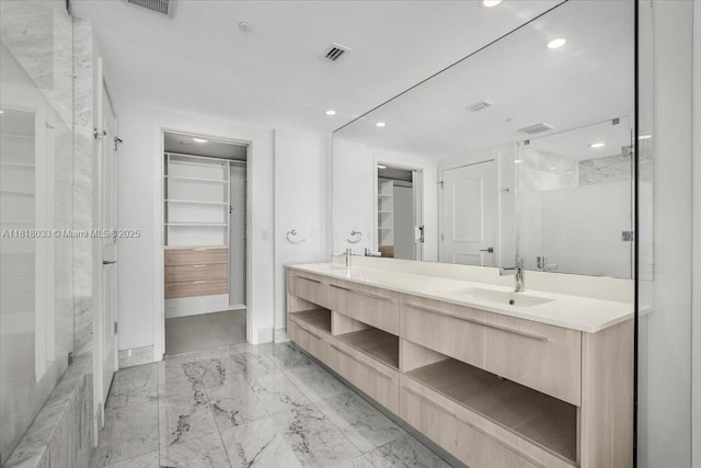 3131 NE 7th Ave Unit 3306, Miami, FL 33137 - full bath featuring a spacious closet, marble finish floors, double vanity, a shower with door, and baseboards