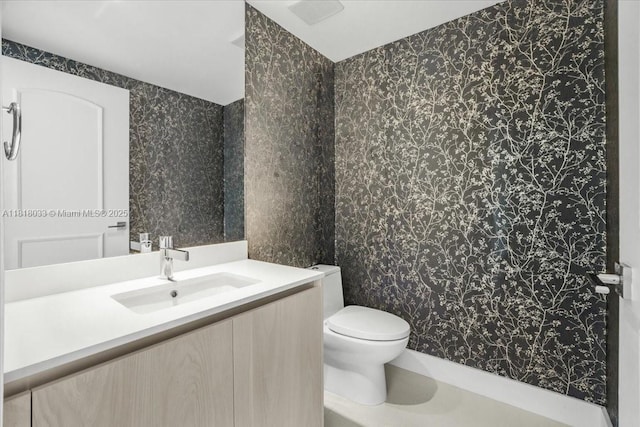 3131 NE 7th Ave Unit 3306, Miami, FL 33137 - bathroom with vanity, wallpapered walls, and toilet