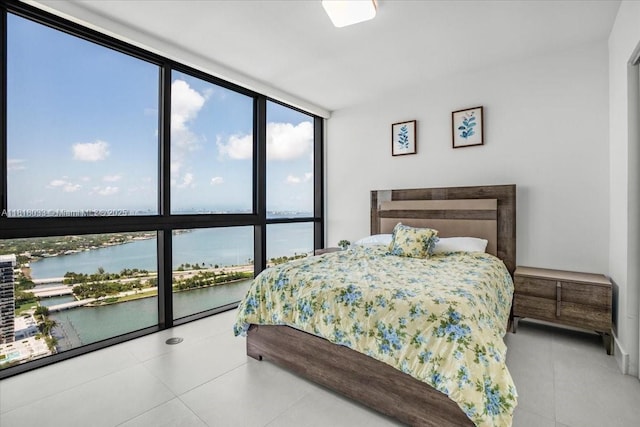 3131 NE 7th Ave Unit 3306, Miami, FL 33137 - tiled bedroom featuring a water view and expansive windows
