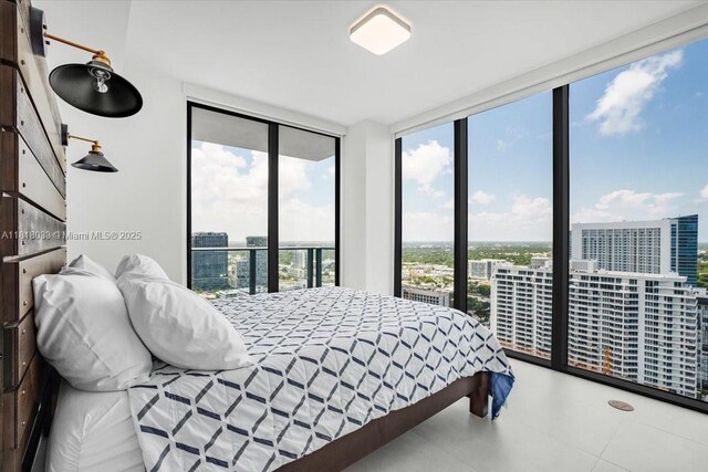 3131 NE 7th Ave Unit 3306, Miami, FL 33137 - bedroom featuring a wall of windows, a city view, and access to outside
