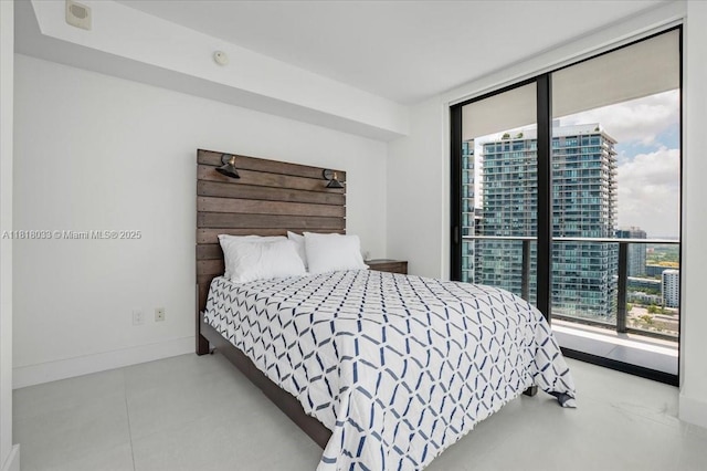 3131 NE 7th Ave Unit 3306, Miami, FL 33137 - bedroom with floor to ceiling windows, baseboards, and access to outside