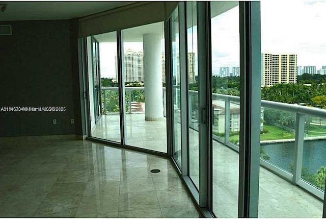 3131 NE 188th St Unit 2-906, Aventura, FL 33180 - entryway featuring healthy amount of natural light, a city view, and a wall of windows