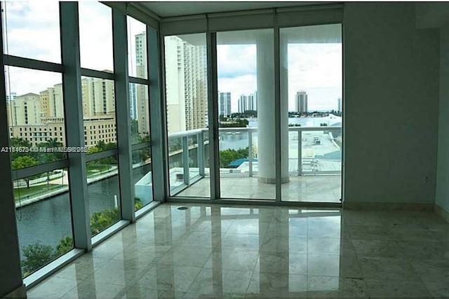 3131 NE 188th St Unit 2-906, Aventura, FL 33180 - entryway with expansive windows, a water view, a city view, and baseboards