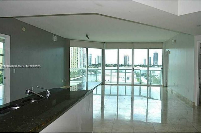 3131 NE 188th St Unit 2-906, Aventura, FL 33180 - empty room with healthy amount of natural light and a city view