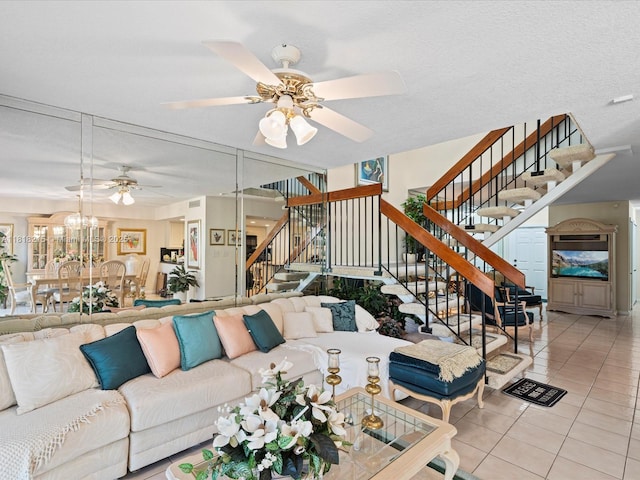 9530 Alcazar Ln, Davie, FL 33324 - tiled living room with stairway, ceiling fan, and a chandelier