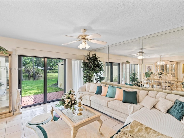 9530 Alcazar Ln, Davie, FL 33324 - living area with ceiling fan, light tile patterned floors, and a textured ceiling