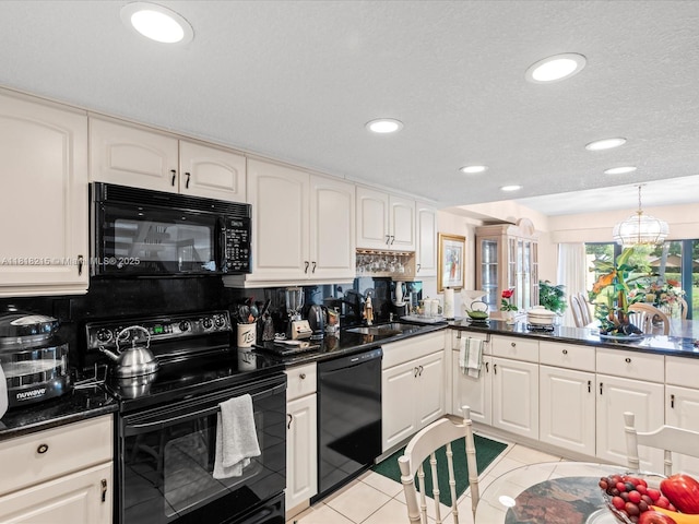 9530 Alcazar Ln, Davie, FL 33324 - kitchen featuring black appliances, a sink, recessed lighting, decorative backsplash, and white cabinetry