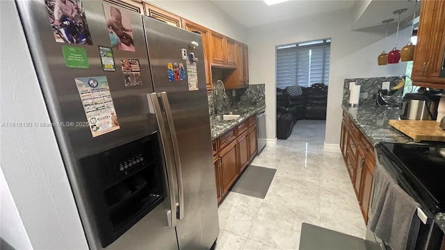 11040 S Lakeview Dr, Pembroke Pines, FL 33026 - kitchen featuring appliances with stainless steel finishes, brown cabinets, and dark stone counters