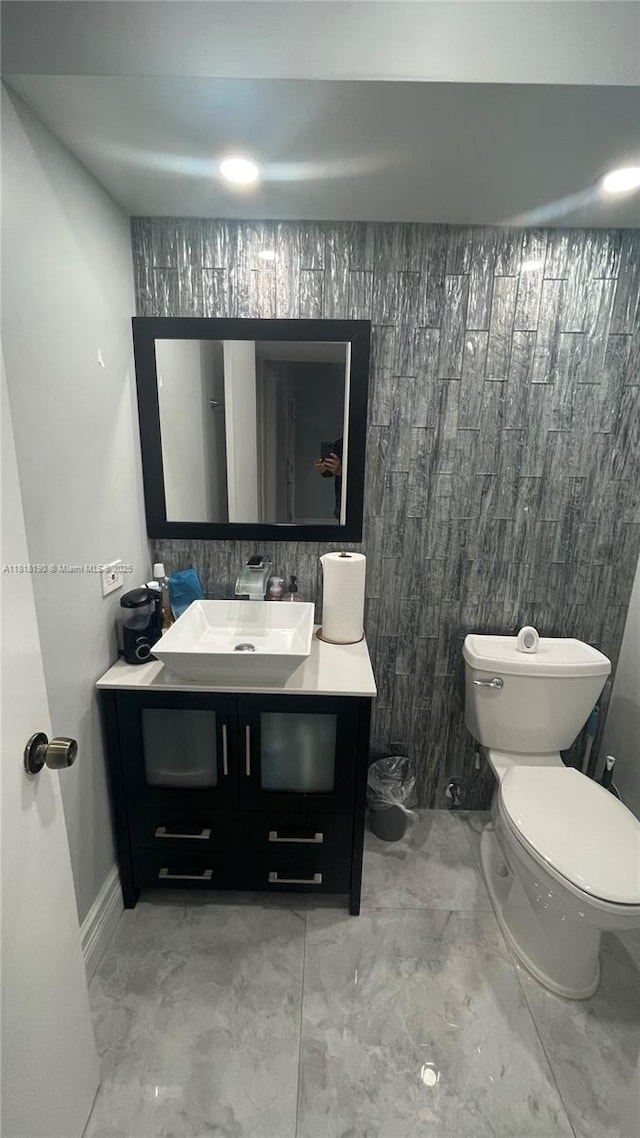 11040 S Lakeview Dr, Pembroke Pines, FL 33026 - half bathroom featuring vanity and marble finish floors