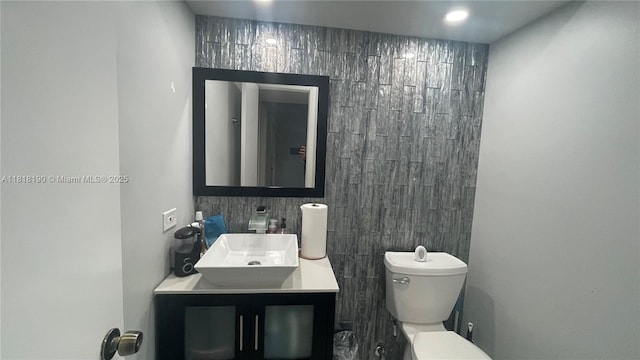 11040 S Lakeview Dr, Pembroke Pines, FL 33026 - half bathroom featuring vanity, tile walls, and recessed lighting